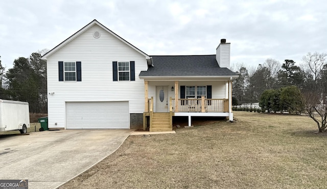 split level home featuring a garage, a front yard, and a porch