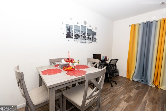 dining room with dark wood-type flooring