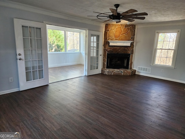 unfurnished living room with dark hardwood / wood-style floors and a wealth of natural light