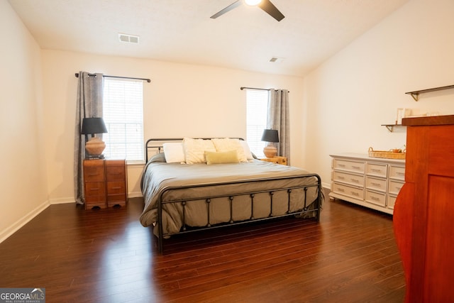 bedroom featuring ceiling fan, lofted ceiling, and dark hardwood / wood-style flooring