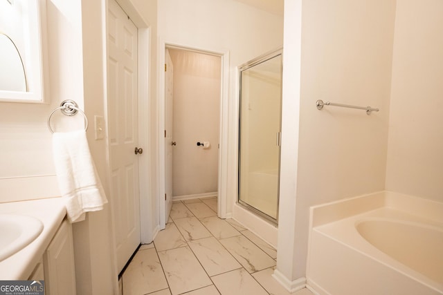 bathroom with shower with separate bathtub and vanity