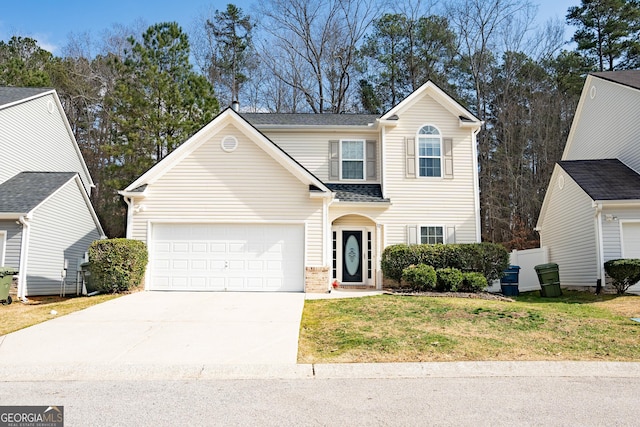 view of property with a garage and a front yard