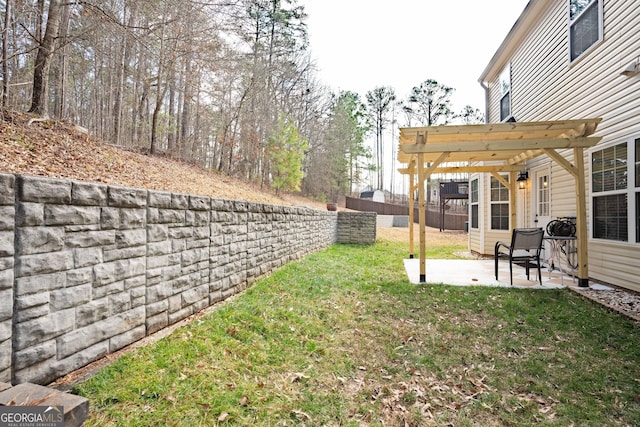 view of yard with a pergola and a patio