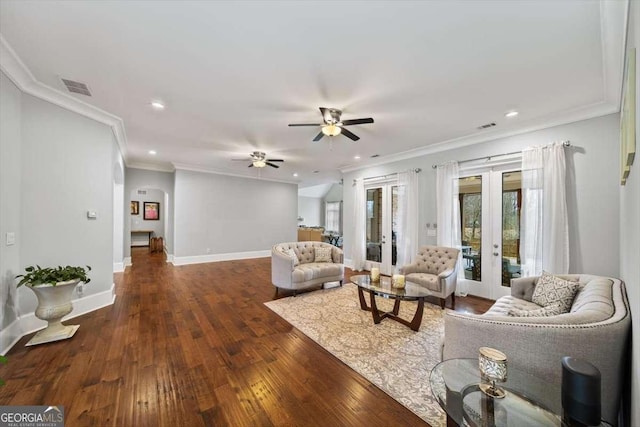 living room featuring french doors, ceiling fan, crown molding, and dark wood-type flooring