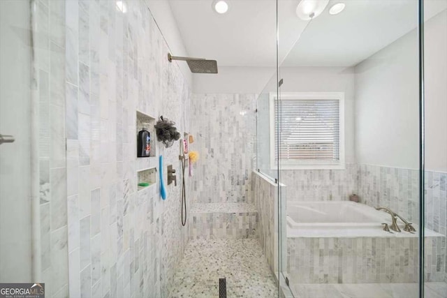 bathroom with separate shower and tub