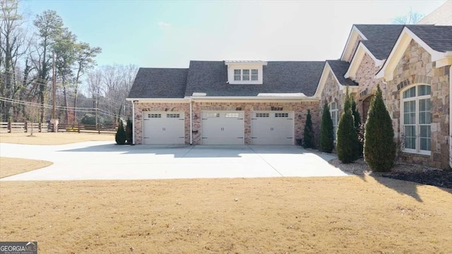 view of home's exterior with a garage and a yard