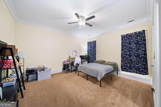 bedroom featuring crown molding, ceiling fan, and carpet flooring