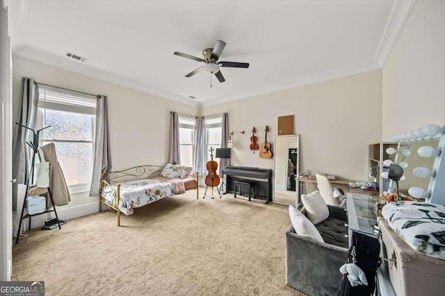 bedroom featuring ornamental molding, ceiling fan, and carpet flooring