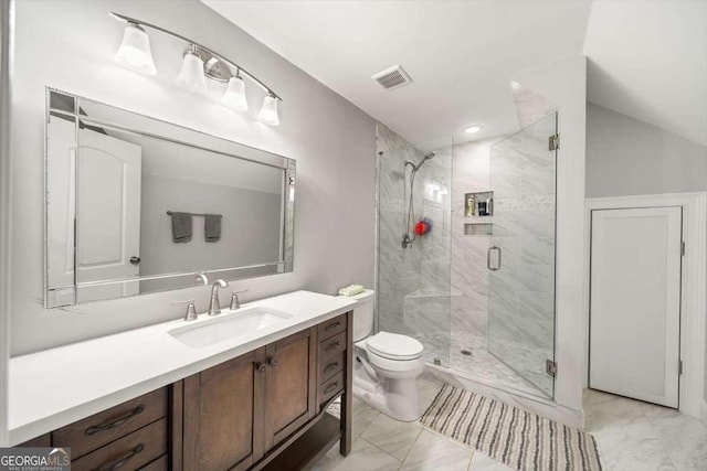 bathroom with vanity, toilet, and an enclosed shower