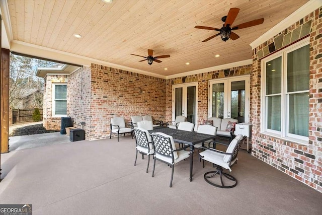 view of patio / terrace featuring ceiling fan and french doors