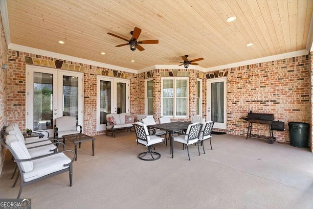 view of patio with an outdoor living space, french doors, ceiling fan, and a grill