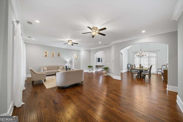 living room featuring crown molding, dark hardwood / wood-style floors, and ceiling fan with notable chandelier