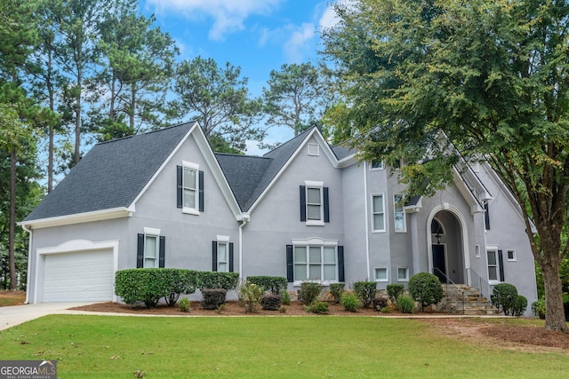 view of front facade with a garage and a front yard