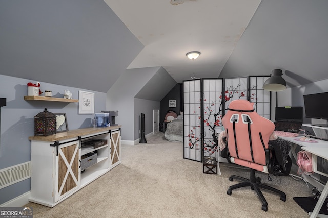 office space featuring lofted ceiling and light colored carpet