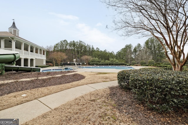 surrounding community with a swimming pool