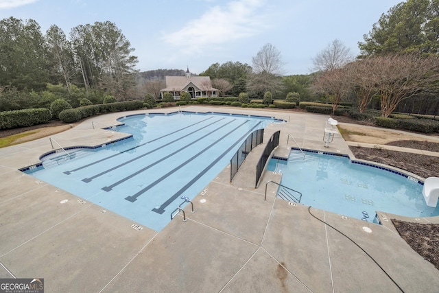 view of swimming pool featuring a patio