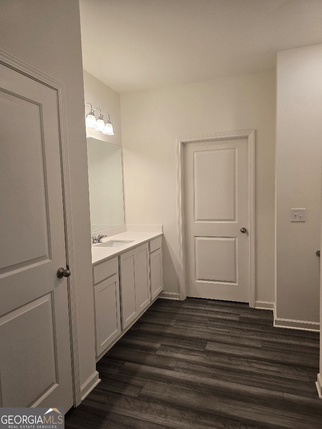 bathroom with hardwood / wood-style flooring and vanity