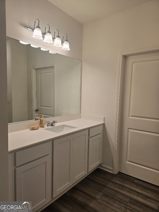 bathroom featuring vanity and hardwood / wood-style flooring