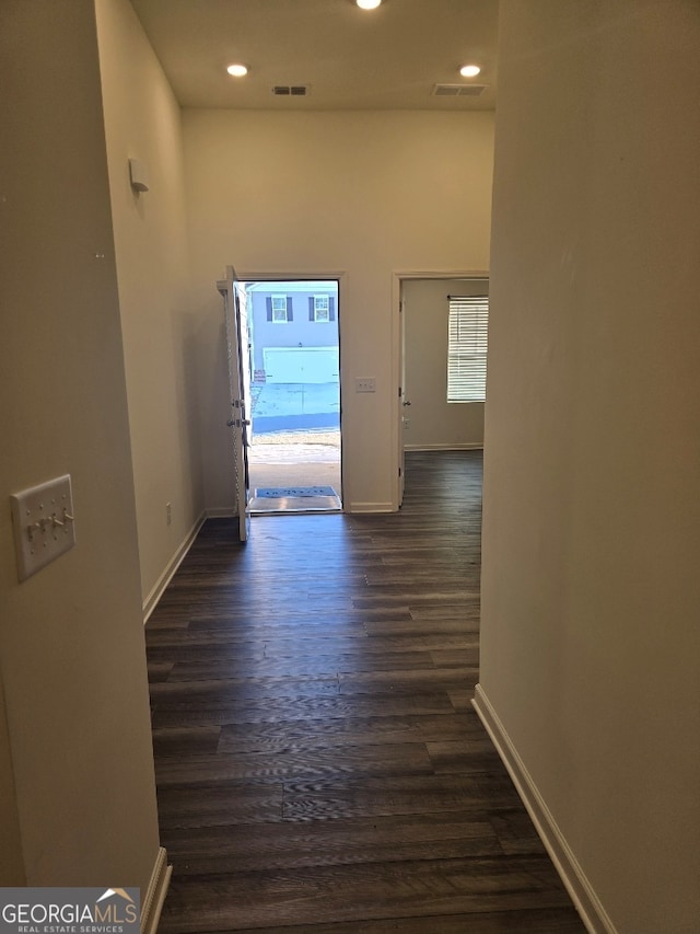 corridor with dark wood-type flooring