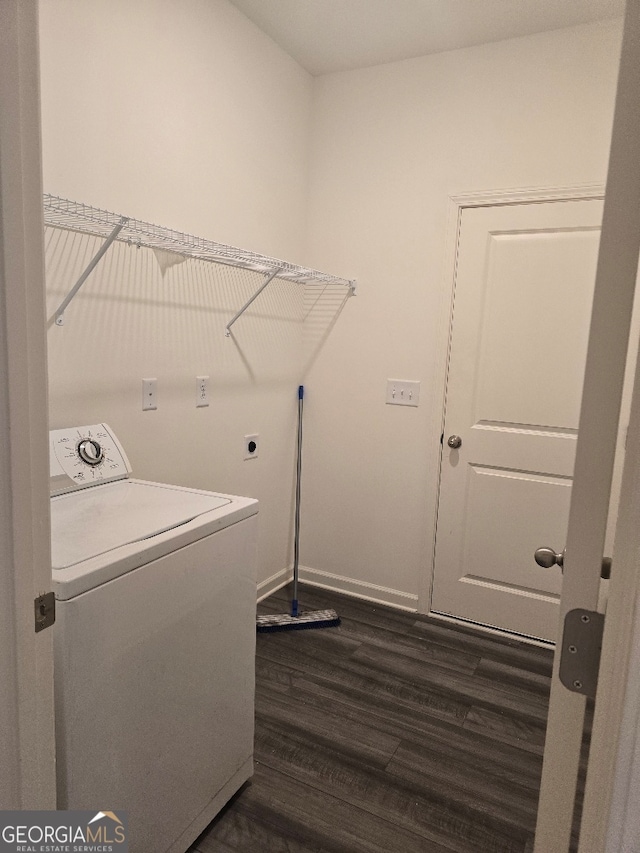 laundry room with dark hardwood / wood-style flooring and washer / dryer