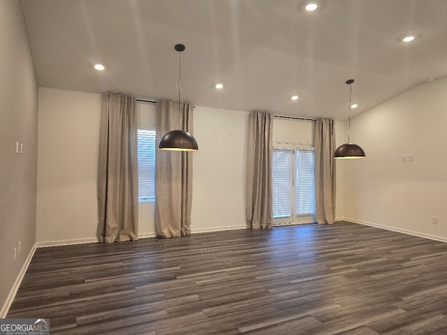 unfurnished room with dark hardwood / wood-style flooring