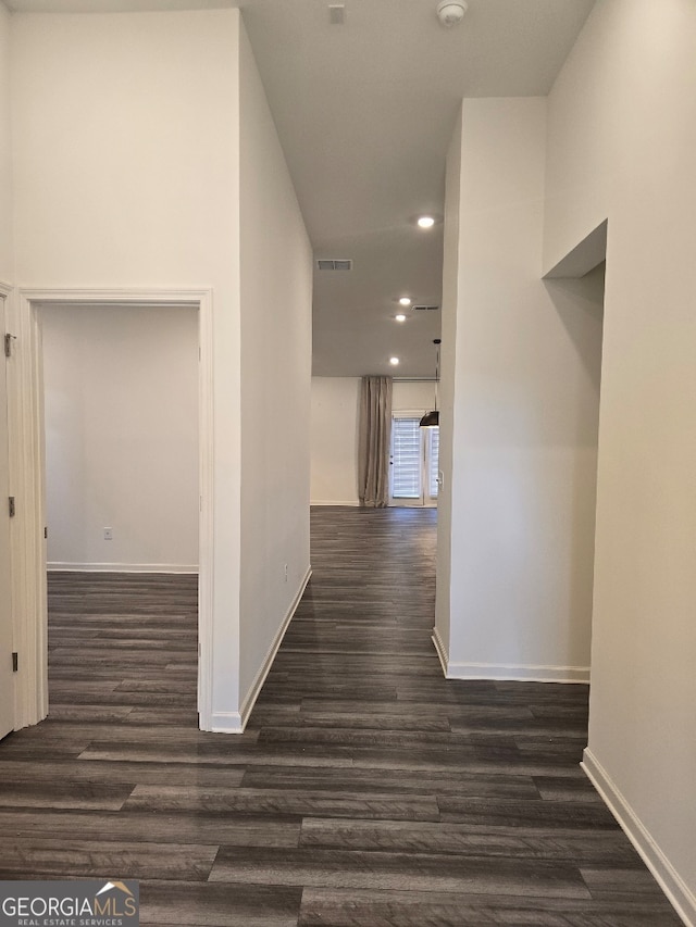 hallway with dark hardwood / wood-style floors