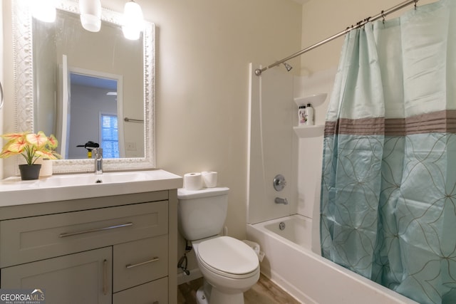 full bathroom with vanity, shower / bathtub combination with curtain, and toilet