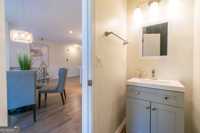 bathroom featuring wood-type flooring and vanity