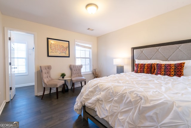 bedroom featuring dark hardwood / wood-style floors