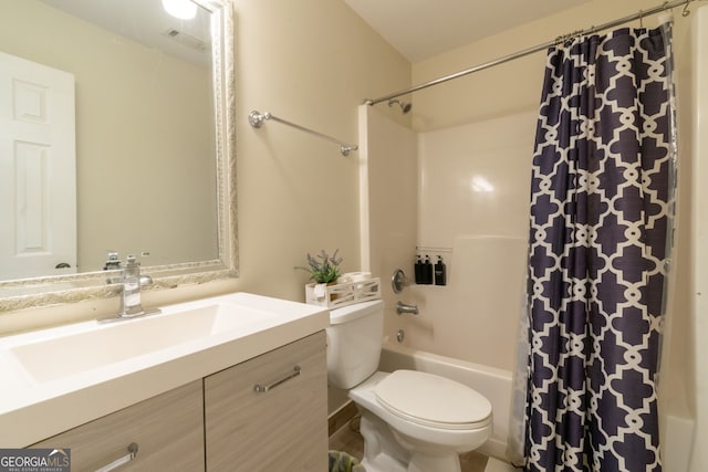 bathroom with shower / bath combo with shower curtain, toilet, vanity, and visible vents