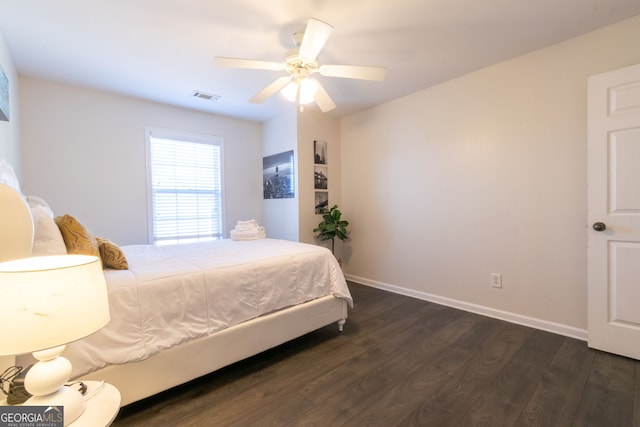 bedroom featuring ceiling fan and dark hardwood / wood-style flooring