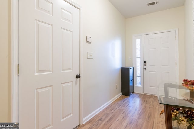 foyer entrance with light hardwood / wood-style flooring