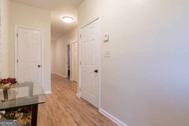 hall with light hardwood / wood-style floors