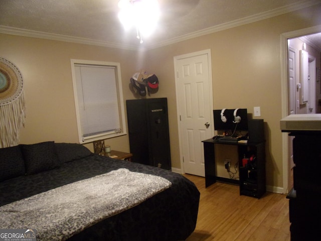 bedroom with light hardwood / wood-style flooring and ornamental molding