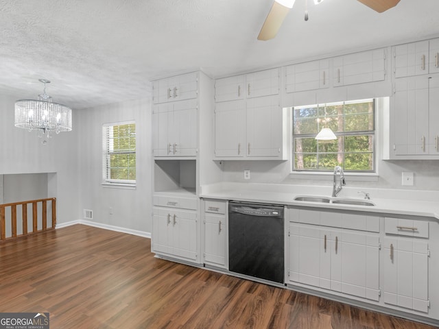 kitchen featuring white cabinetry, black dishwasher, and sink