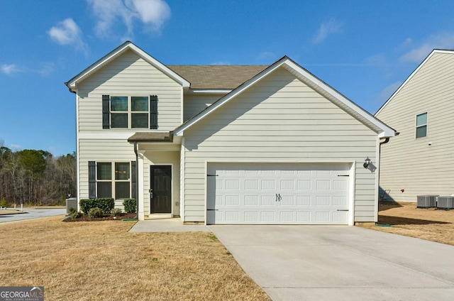 front facade with a garage, a front yard, and central air condition unit