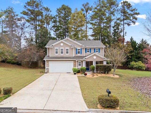 view of front of property featuring a garage and a front lawn