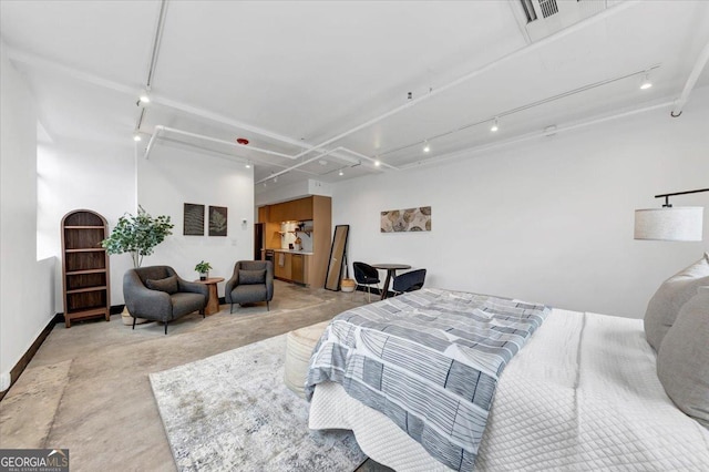 bedroom featuring track lighting