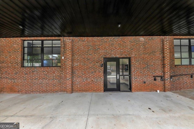 doorway to property featuring a patio area