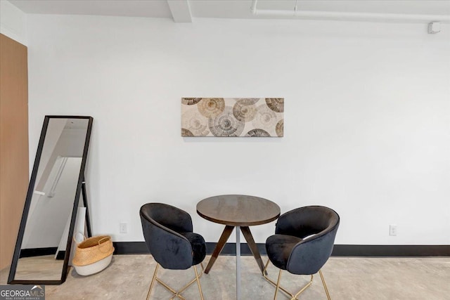 sitting room with beamed ceiling