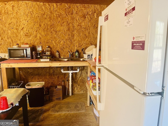 277 Deer Run Rd, Folkston, GA 31537 - interior space with a sink, stainless steel microwave, freestanding refrigerator, and wood finished floors