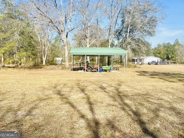 view of yard with a carport