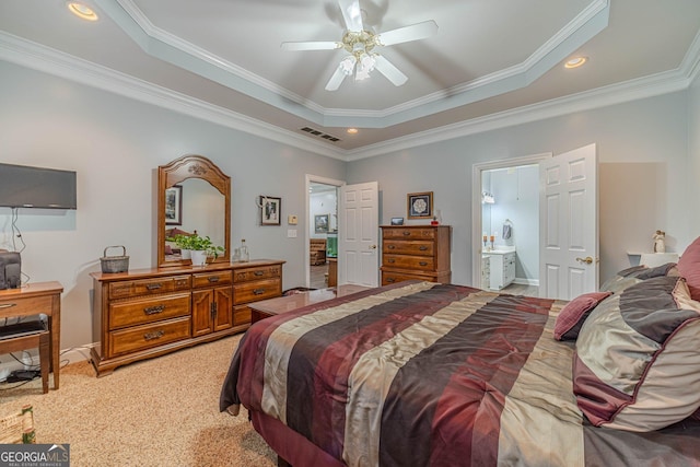 bedroom with ceiling fan, ensuite bathroom, carpet, ornamental molding, and a raised ceiling