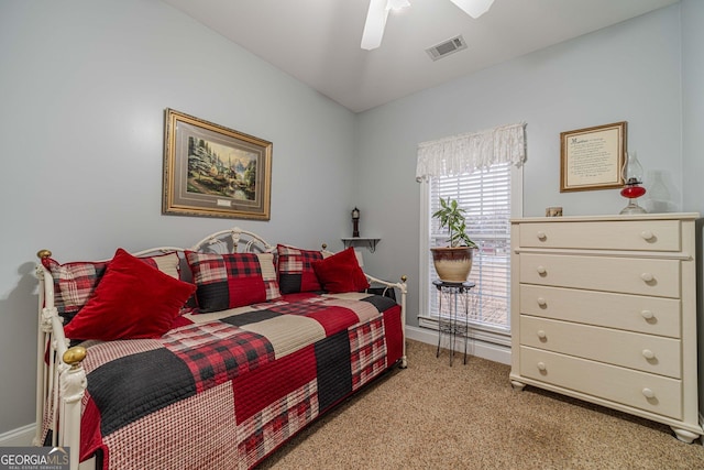 bedroom with light carpet and ceiling fan