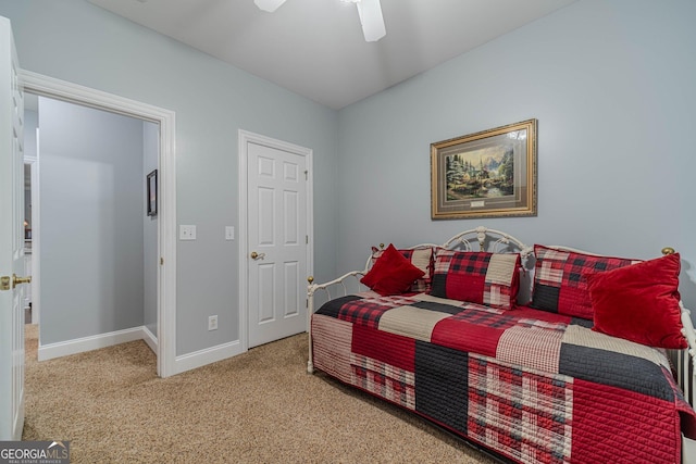 carpeted bedroom with ceiling fan