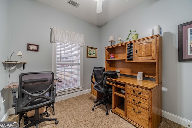 office space with light carpet and ceiling fan