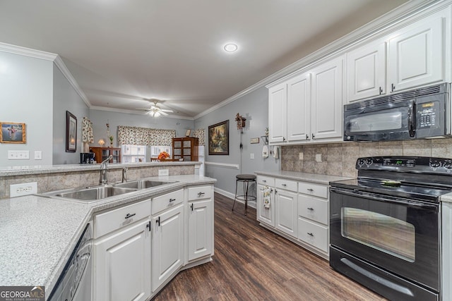 kitchen with dark wood-type flooring, sink, black appliances, ornamental molding, and white cabinets