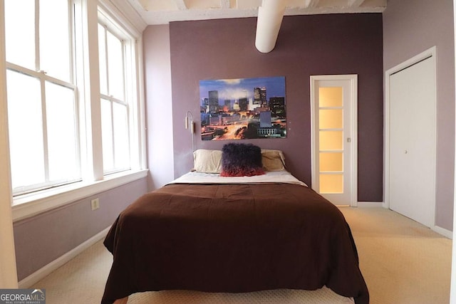 bedroom with light colored carpet