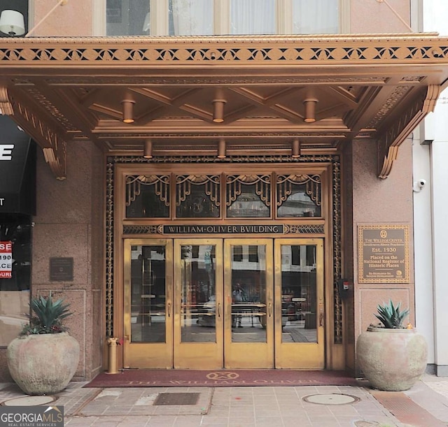 property entrance featuring french doors