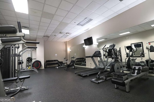 workout area featuring a paneled ceiling